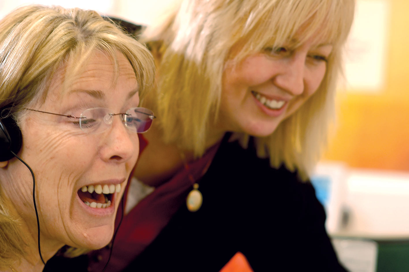 Learner and tutor smiling