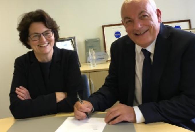 Axia Solutions and Community sign learning agreement